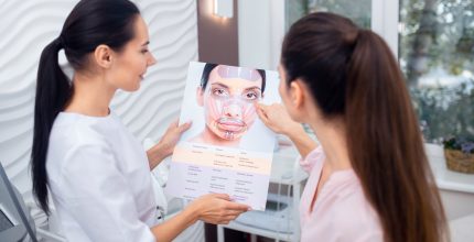 Dark-haired patient asking questions about facial muscles